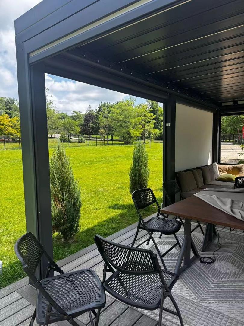 Open pergola structure on a green lawn