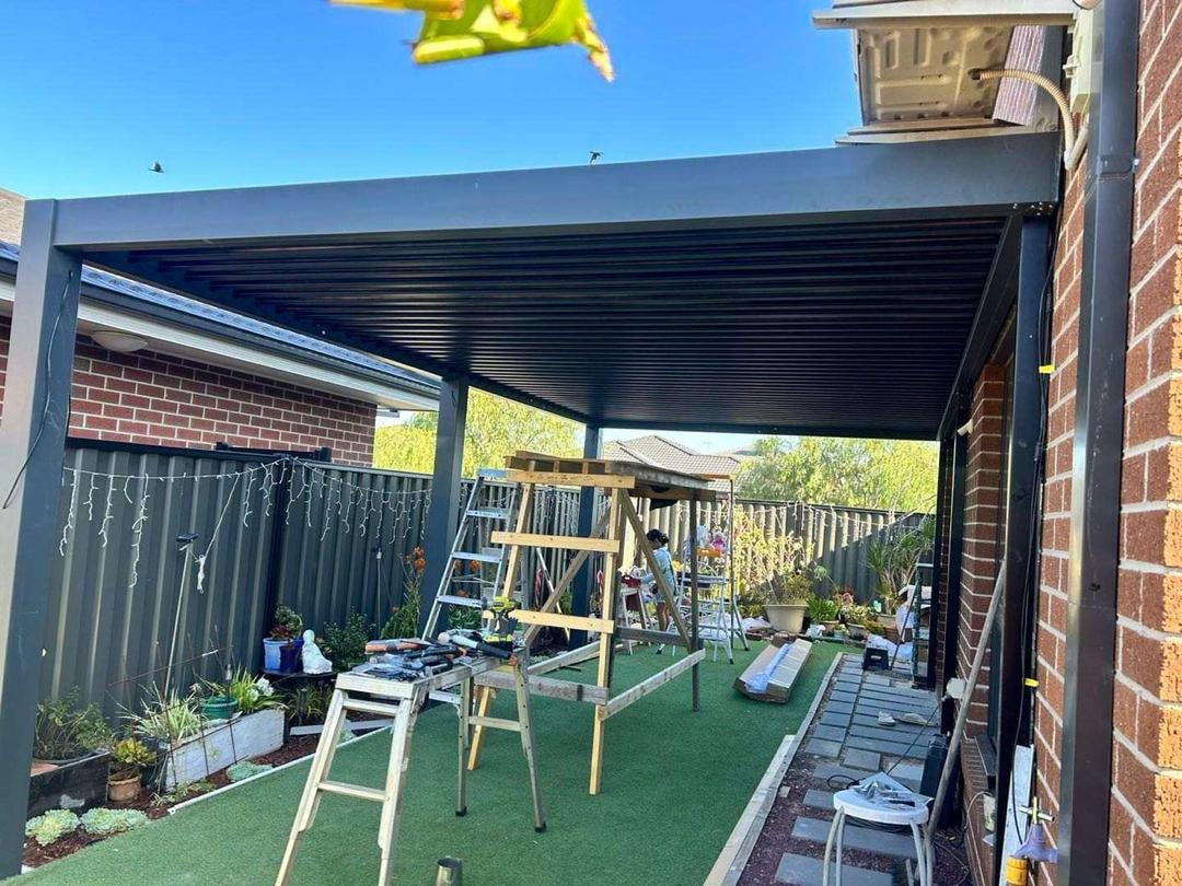 Pergola over artificial turf backyard